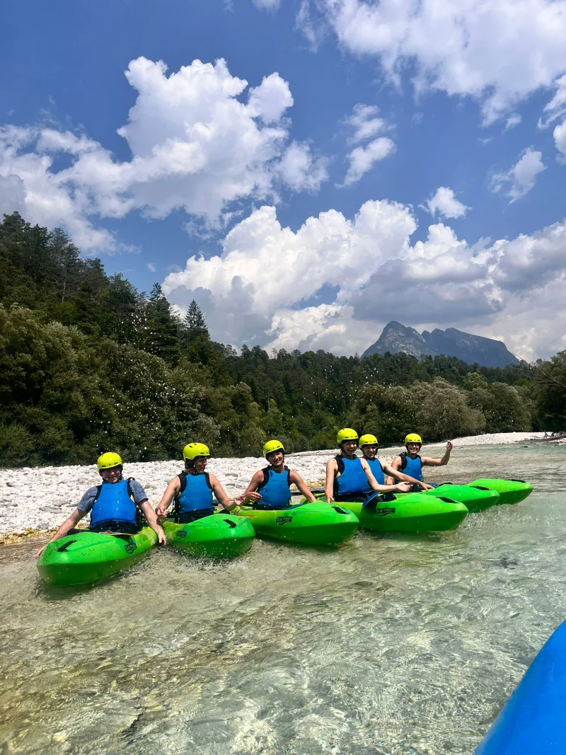 Kayak group on crystal clear water
