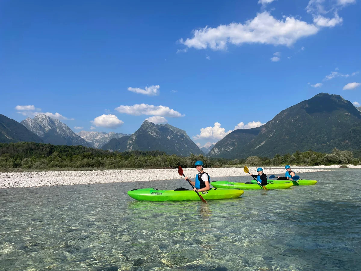 Kayaking on the Soča with mountain views
